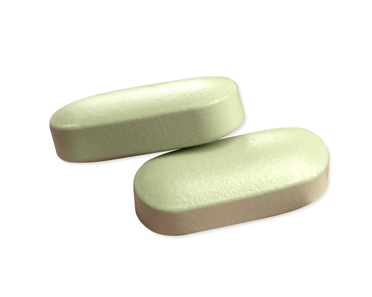 Close up of two coated oval-shaped tablets, one resting on the other